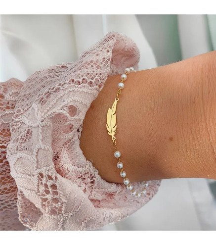 Stainless steel bracelet with white pearls and feather